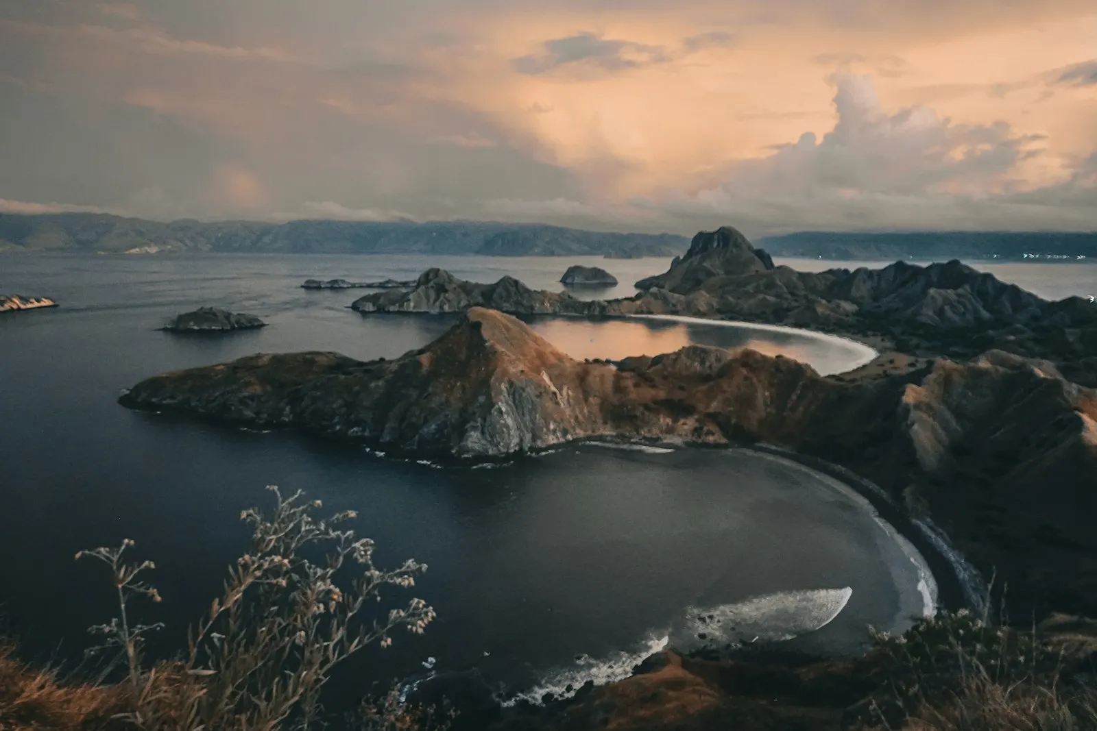 Rocky islands in a calm bay at sunset